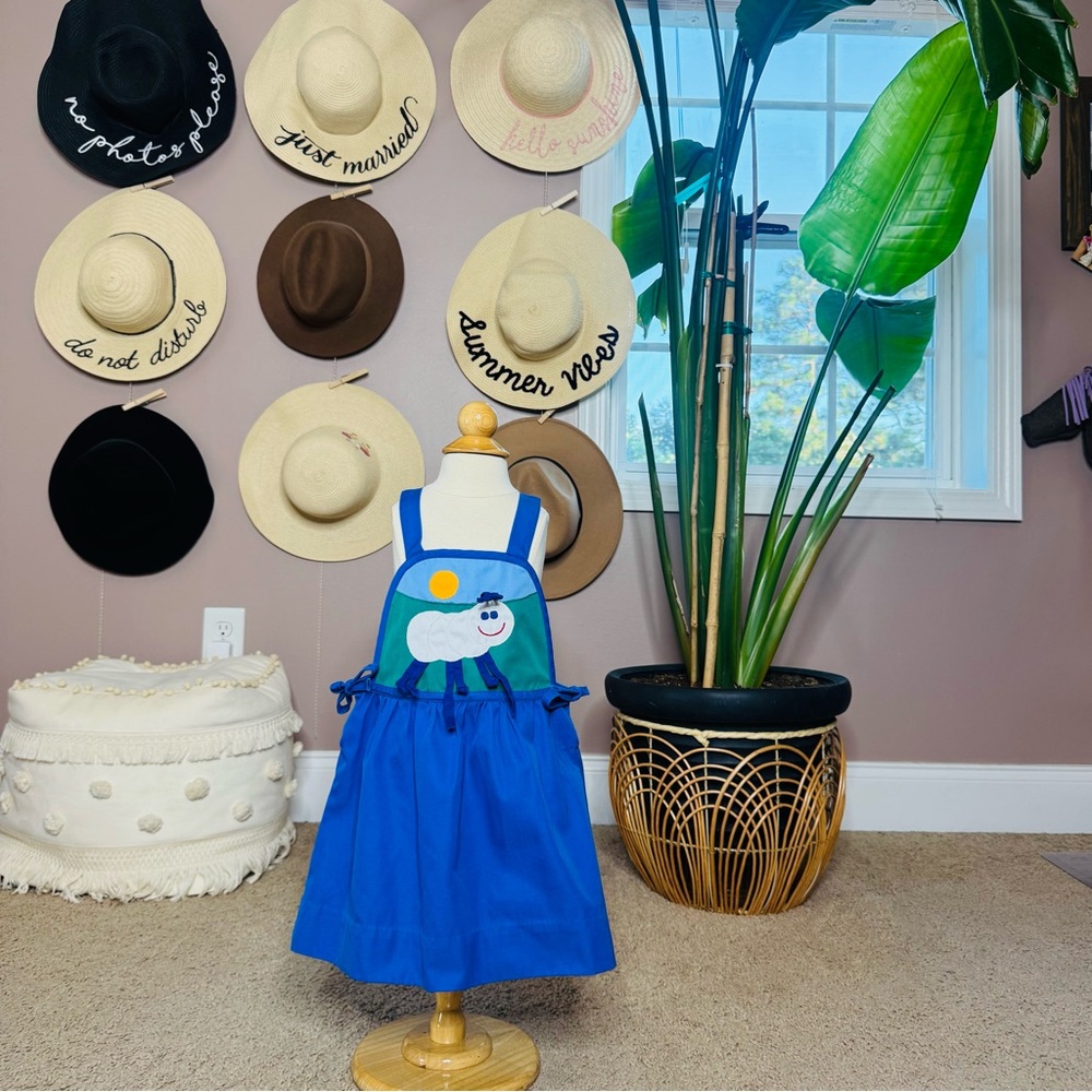 Vintage blue dress with caterpillar design